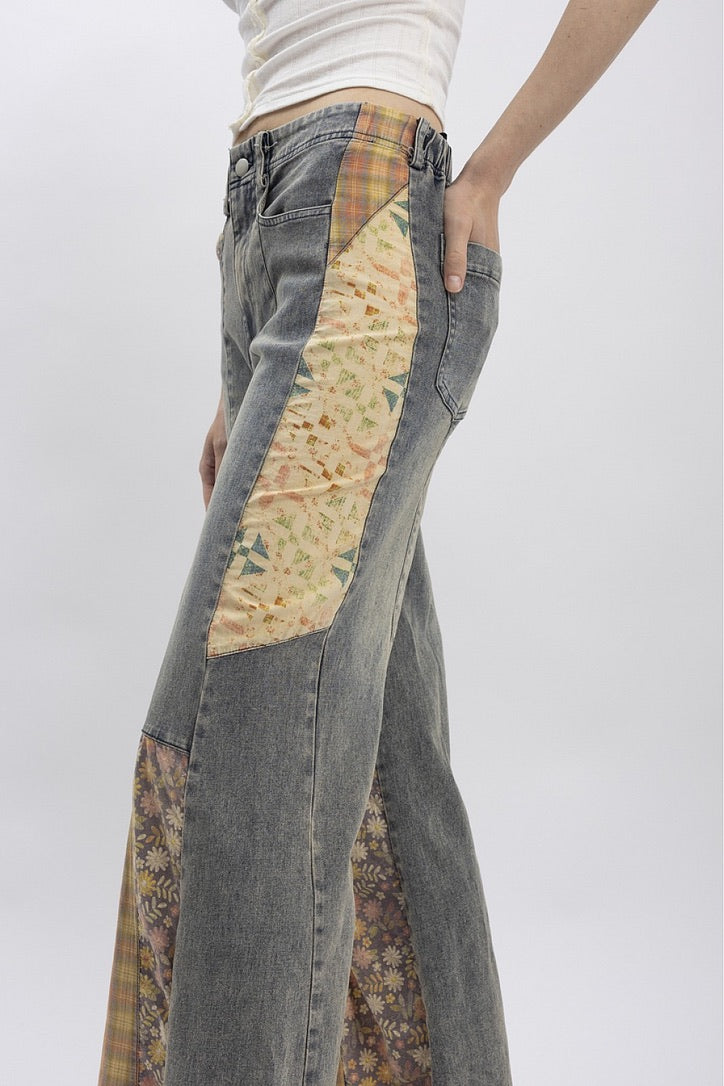 Trestles Clothing Company Cut & Sew jeans featuring grey denim with floral and plaid patchwork side panels.