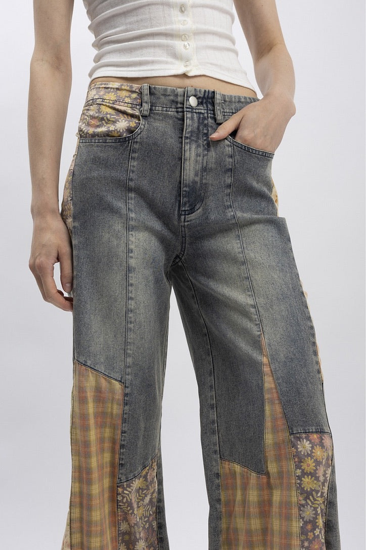 Trestles Clothing Company Cut & Sew jeans featuring grey denim with vintage-style floral and plaid patchwork inserts.