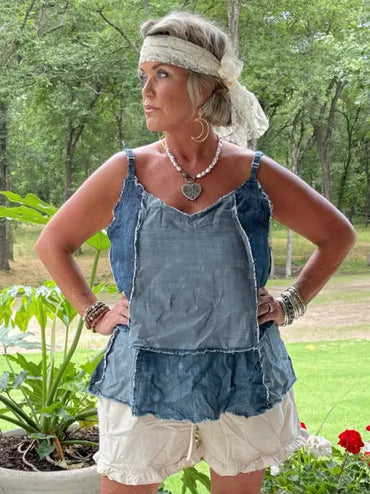 Trestles Clothing Company patchwork denim tank top with adjustable straps and distressed hem worn by a woman outdoors