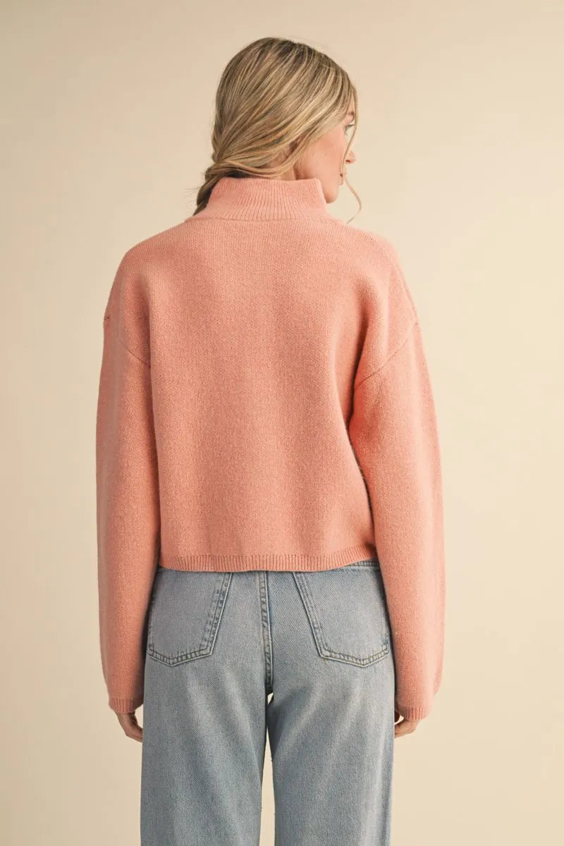 Trestles Clothing Company peach knit zip-up sweater with a stand collar and relaxed fit, viewed from the back