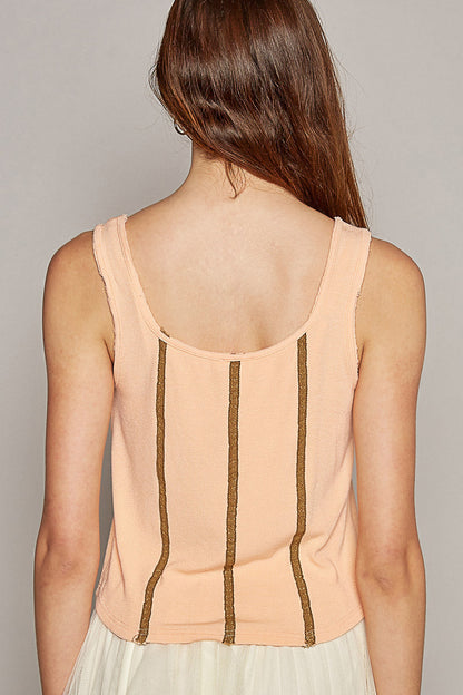 Back view of Trestles Clothing Company peach fitted sleeveless knit tank with vertical brown lace trim details