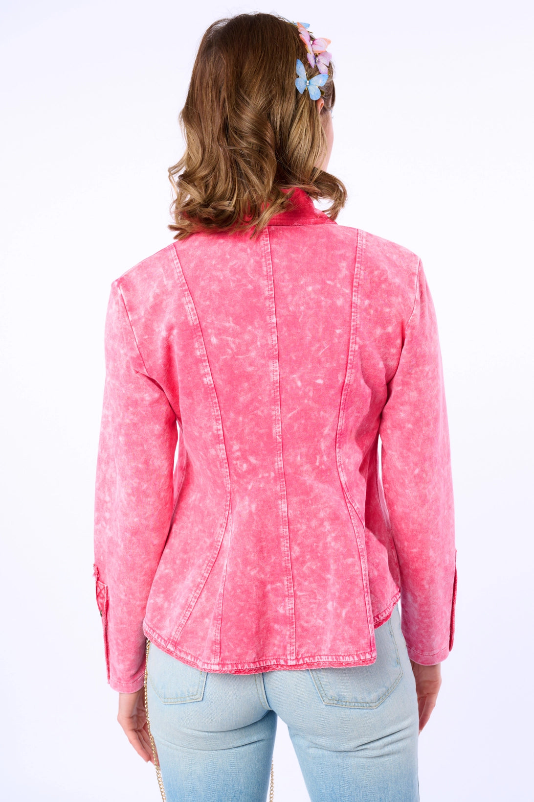 Back view of Trestles Clothing Company Juliet French Terry Blazer in acid washed pink with butterfly hair accessories