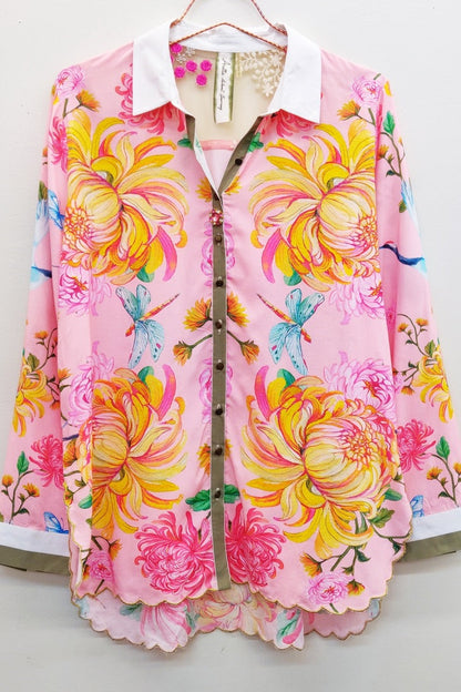 Trestles Clothing Company pink viscose blouse with floral crane print, white collar, and embroidered back detail.
