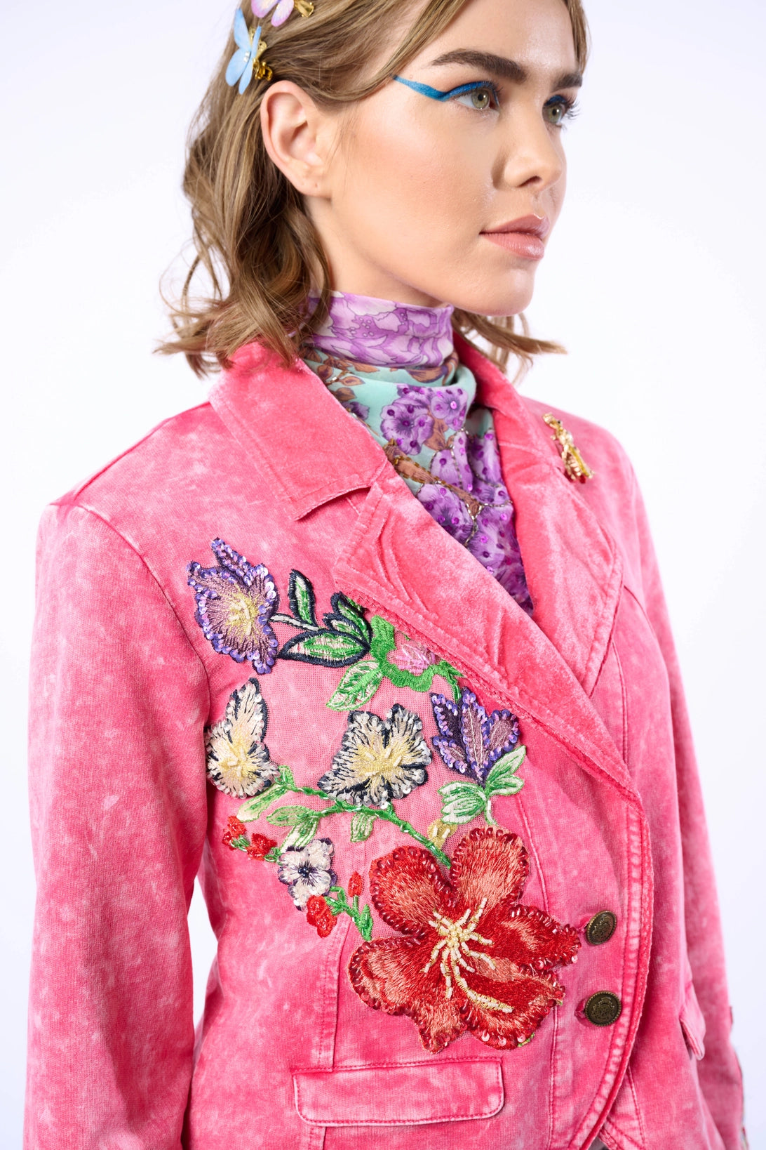 Trestles Clothing Company acid washed pink French terry blazer with velvet lapel, floral embroidery, and bee brooch