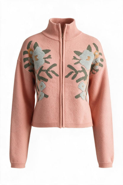 Trestles Clothing Company pink knit zip-up sweater with floral embroidery, stand collar, and long puff sleeves.