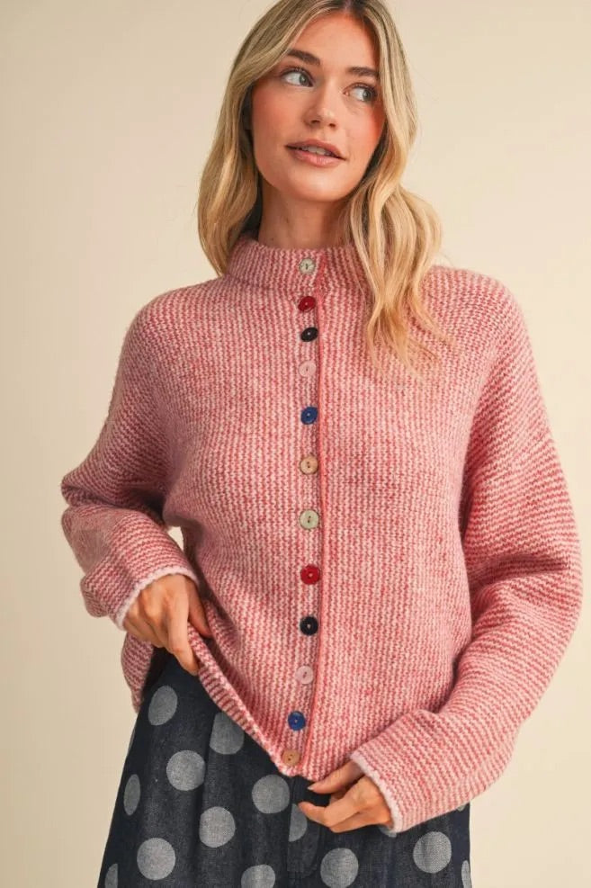 Trestles Clothing Company Buttons Sweater in pink with unique mismatched colorful buttons and a cozy mock neck design.