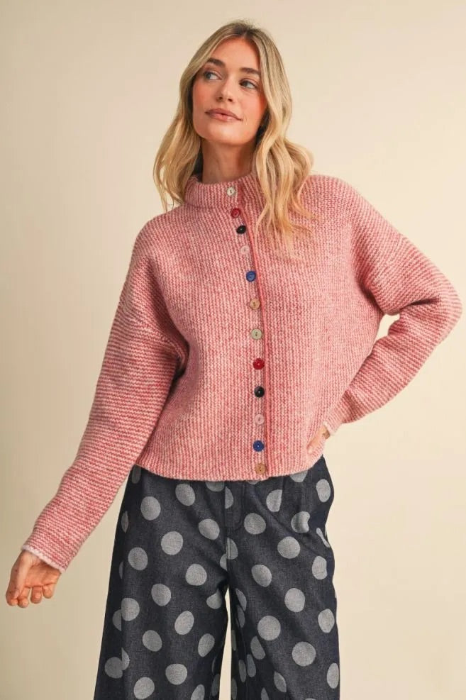 Trestles Clothing Company cozy pink knit sweater with unique mismatched colorful buttons and a high neckline.