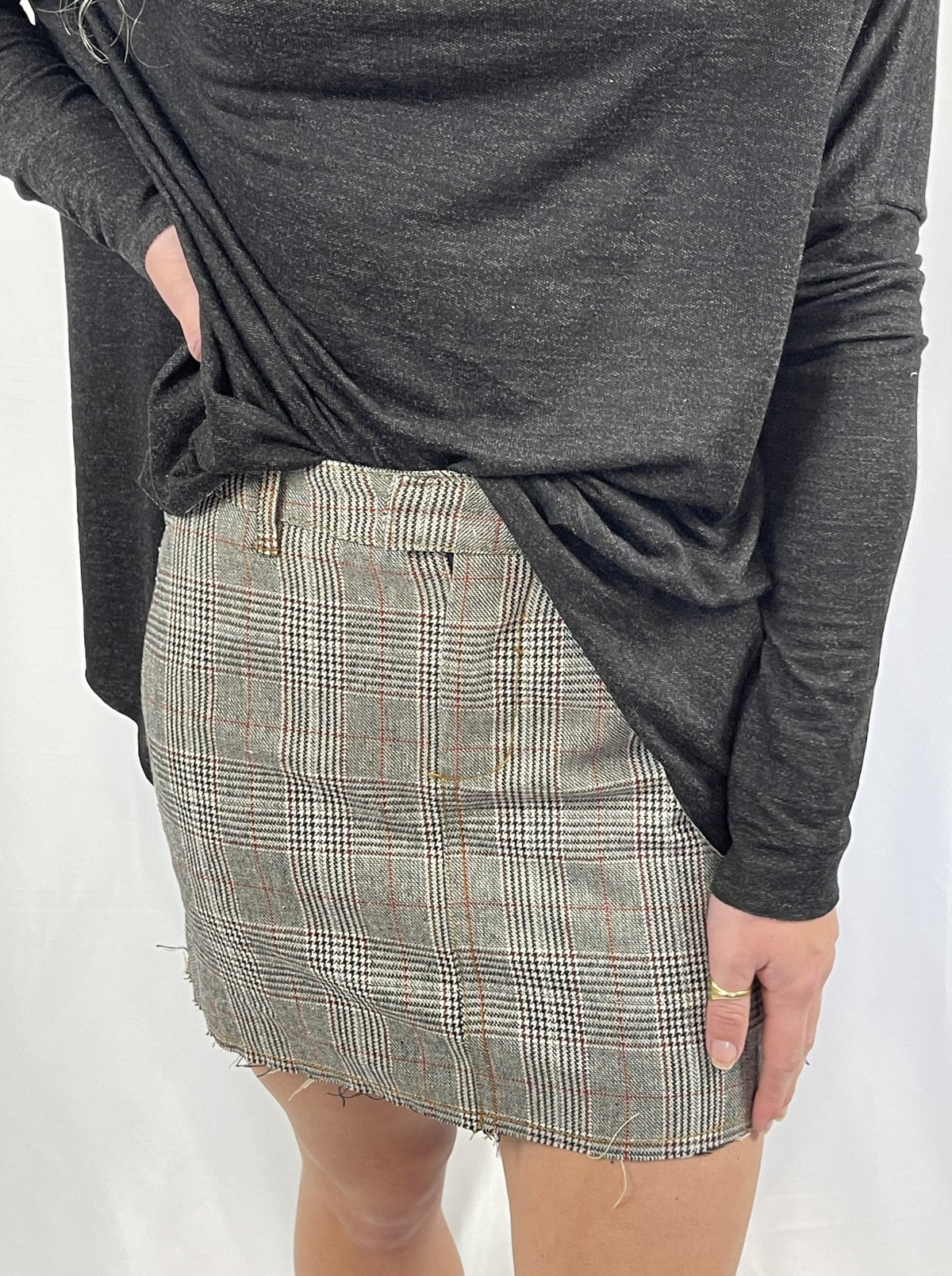 Trestles Clothing Company micro plaid mini skirt with a raw hem and upcycled denim aesthetic