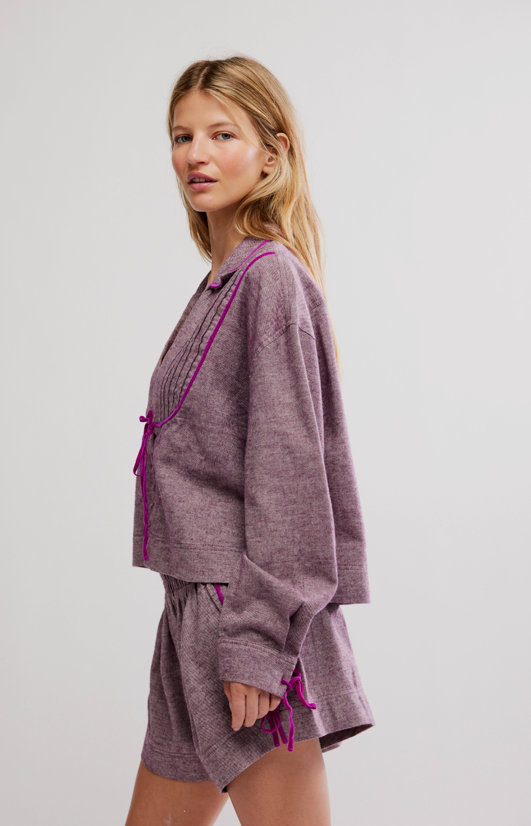 Trestles Clothing Company Close To Home flannel top in purple with velvet trim and ties, worn by a blonde model.