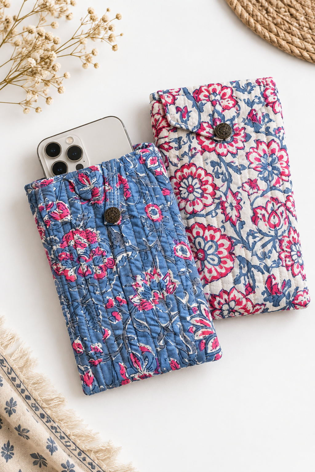 Trestles Clothing Company quilted cotton boho cell bags in blue and white floral patterns with button closures.