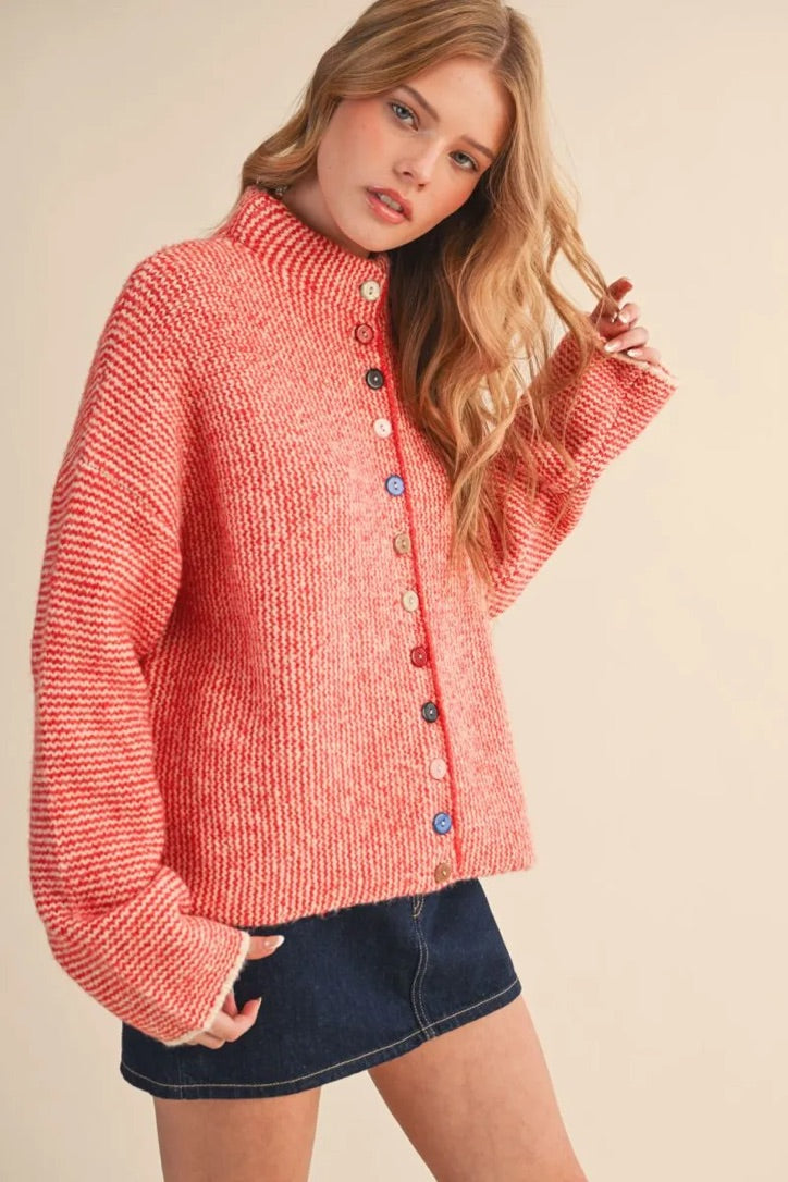 Trestles Clothing Company cozy red knit sweater featuring unique mismatched buttons and a high neckline