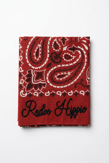 Trestles Clothing Company red stonewashed bandana with white paisley print and black Rodeo Hippie chainstitching.