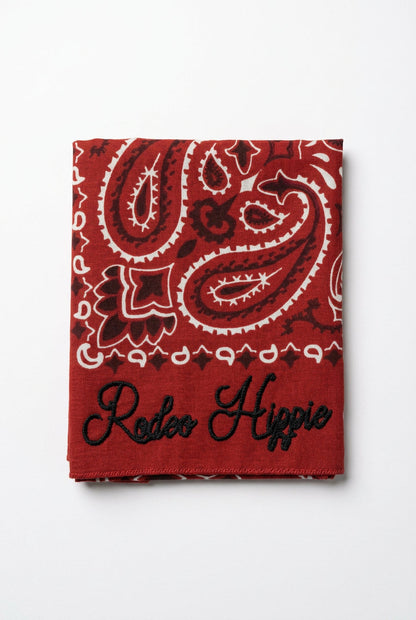 Trestles Clothing Company red stonewashed bandana with white paisley print and black Rodeo Hippie chainstitching.