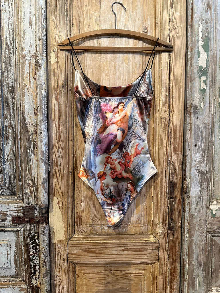 Trestles Clothing Company Old World Bodysuit with shiny Renaissance art print, thin straps, and fitted silhouette.