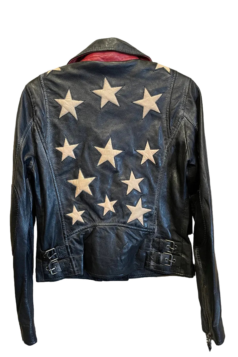 Trestles Clothing Company black lamb leather jacket with cream star appliqués on the back and side buckle details.