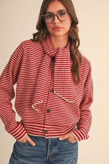 Trestles Clothing Company red and white striped button-up sweater with an attached scarf worn by a woman.