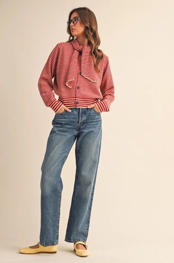 Trestles Clothing Company red and white striped boxy knit sweater with an attached scarf worn with blue jeans