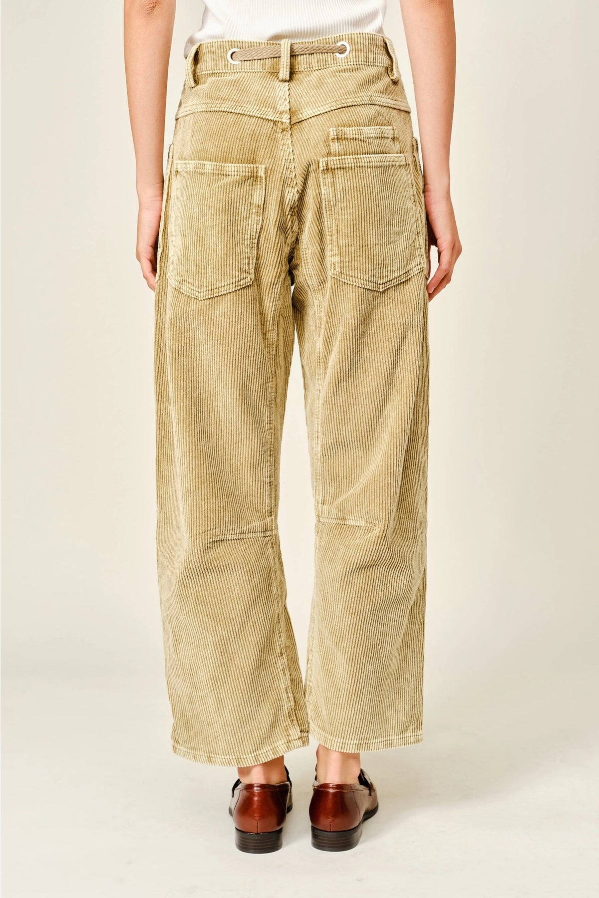 Back view of Trestles Clothing Company tan corduroy barrel pants with cropped length and back pockets