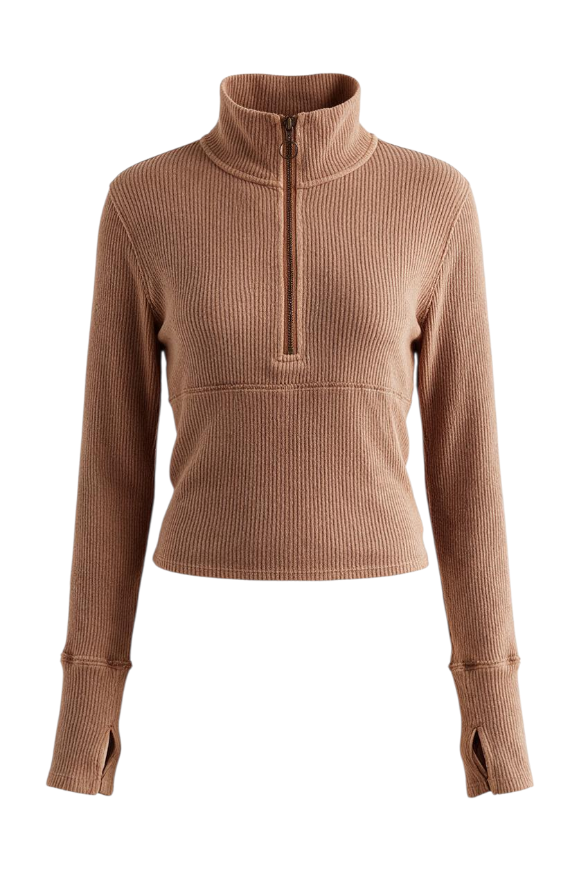Trestles Clothing Company tan ribbed half-zip long sleeve top with exposed seams and exaggerated cuffs on a model