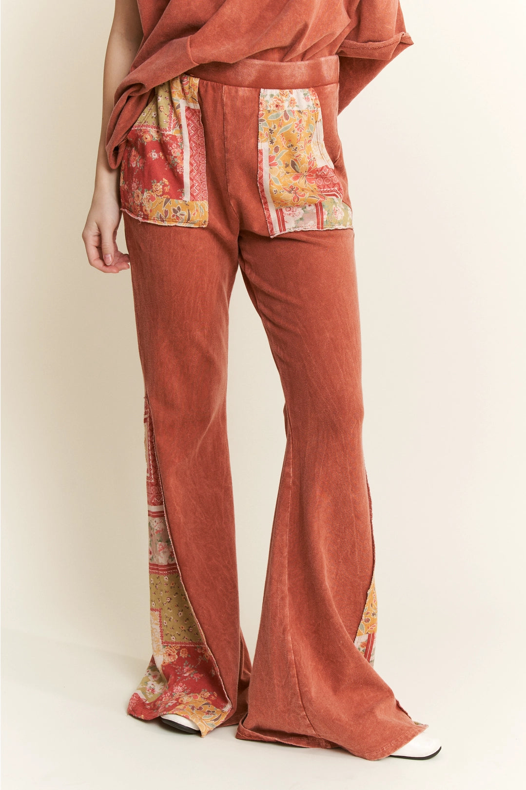 Trestles Clothing Company mineral washed bell bottom pants with floral patch pockets and elastic waistband