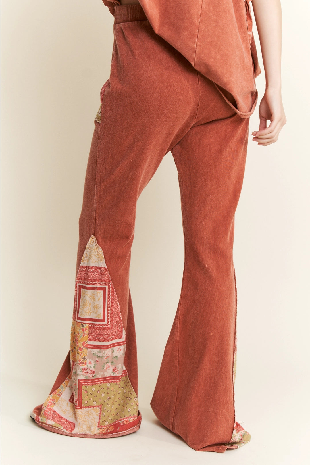 Trestles Clothing Company mineral washed terracotta bell bottom pants with boho floral patch print and elastic waist