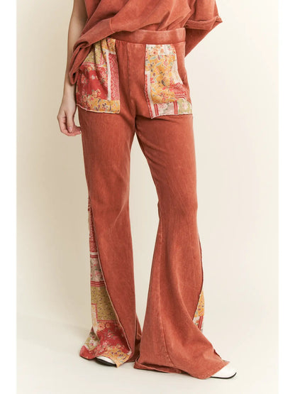Trestles Clothing Company mineral washed bell bottom pants in rust with boho floral patch pockets and side panels