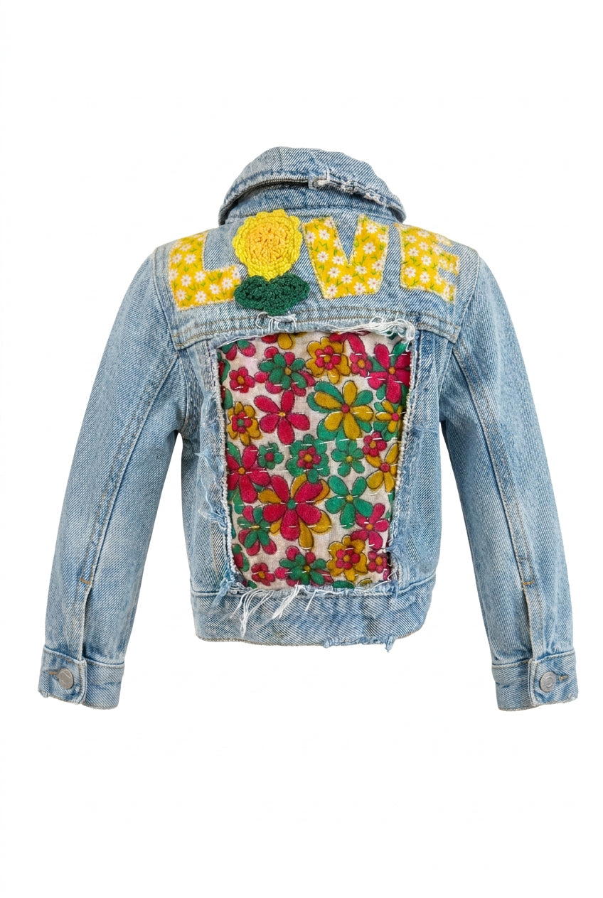 Trestles Clothing Company upcycled denim baby jacket with floral Kantha patchwork and LOVE appliqué on the back