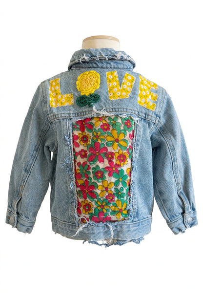 Trestles Clothing Company upcycled denim baby jacket with floral Kantha patchwork and LOVE appliqué on the back