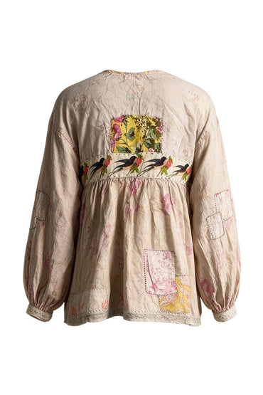 Back view of Trestles Clothing Company Weathered Wildflower Top featuring faded roses, floral appliqués, and patches.