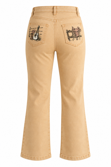 Trestles Clothing Company high-rise wide leg jeans in sand wash denim with vintage Western back pocket graphics.