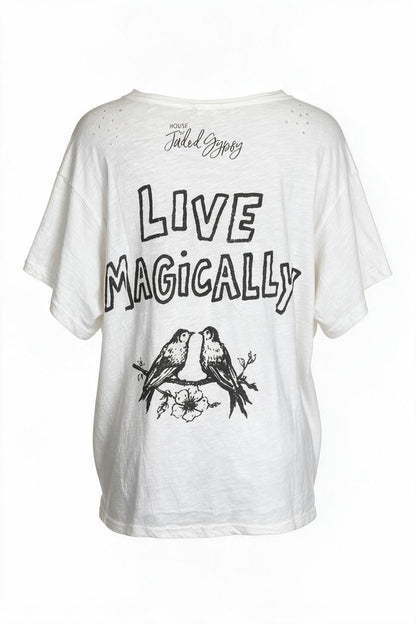 Trestles Clothing Company white oversized cotton graphic tee with Live Magically bird print and light distressing