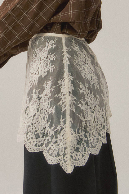 Trestles Clothing Company white asymmetrical lace skirt overlay with intricate floral patterns for boho layering.