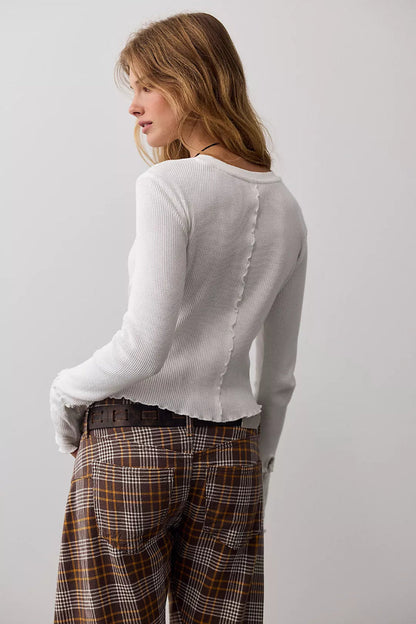 Trestles Clothing Company white waffle knit long sleeve top with lace detail and lettuce edge trim on a model
