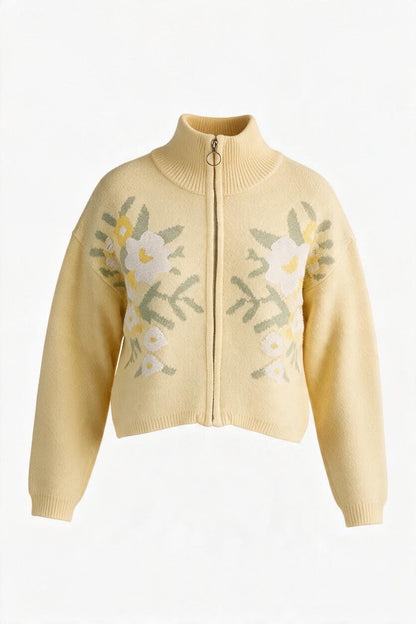 Trestles Clothing Company yellow floral knit zip-up sweater with a stand collar and long puff sleeves.
